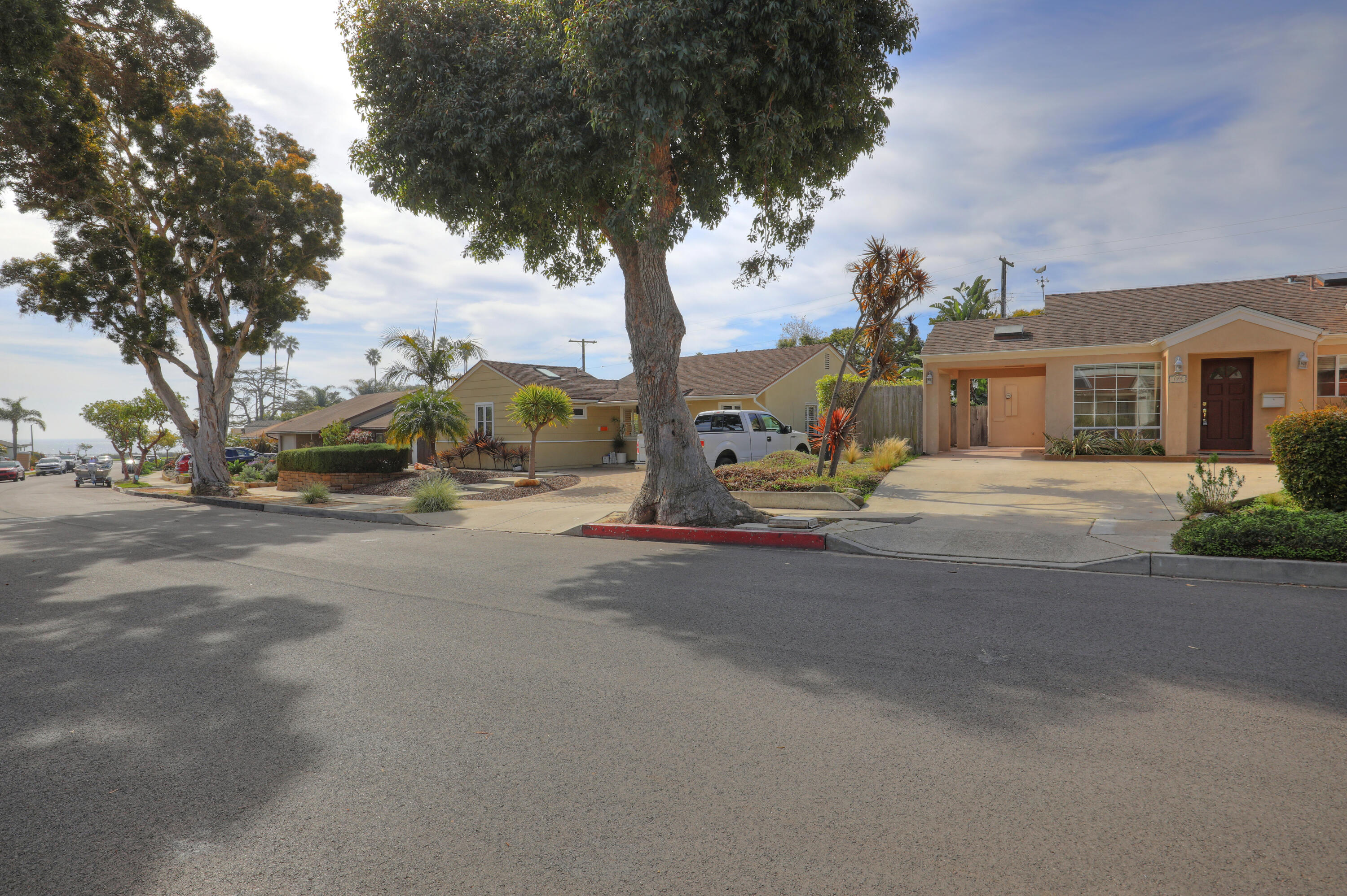 129 San Clemente Santa Barbara, CA 93109 - Photo 2 of 23 a view of road with large trees
