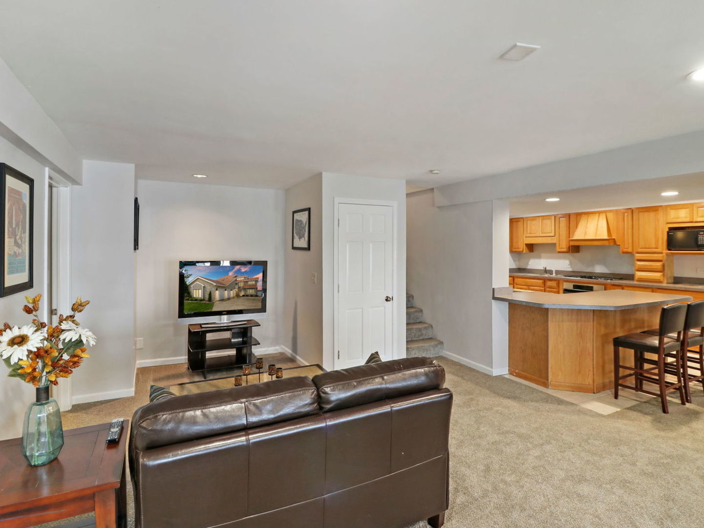 132 Eagle Point Road Fox Lake, IL 60020 - Photo 37 of 63 a living room with stainless steel appliances kitchen island granite countertop a sink and cabinets