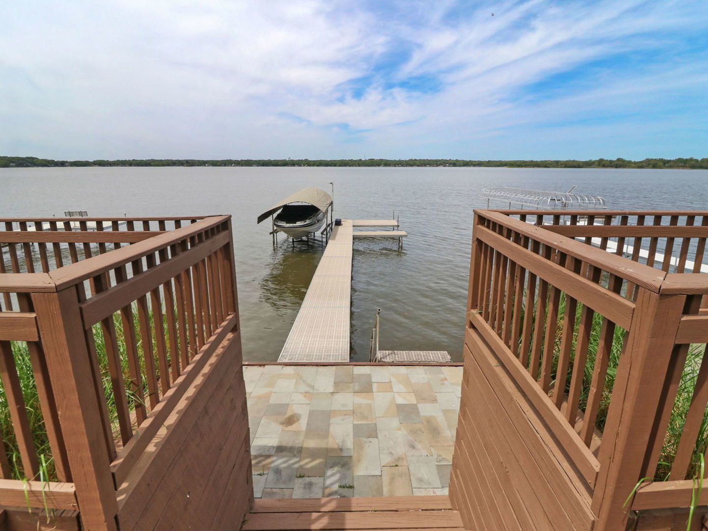 132 Eagle Point Road Fox Lake, IL 60020 - Photo 49 of 63 a view of balcony with wooden floor and fence