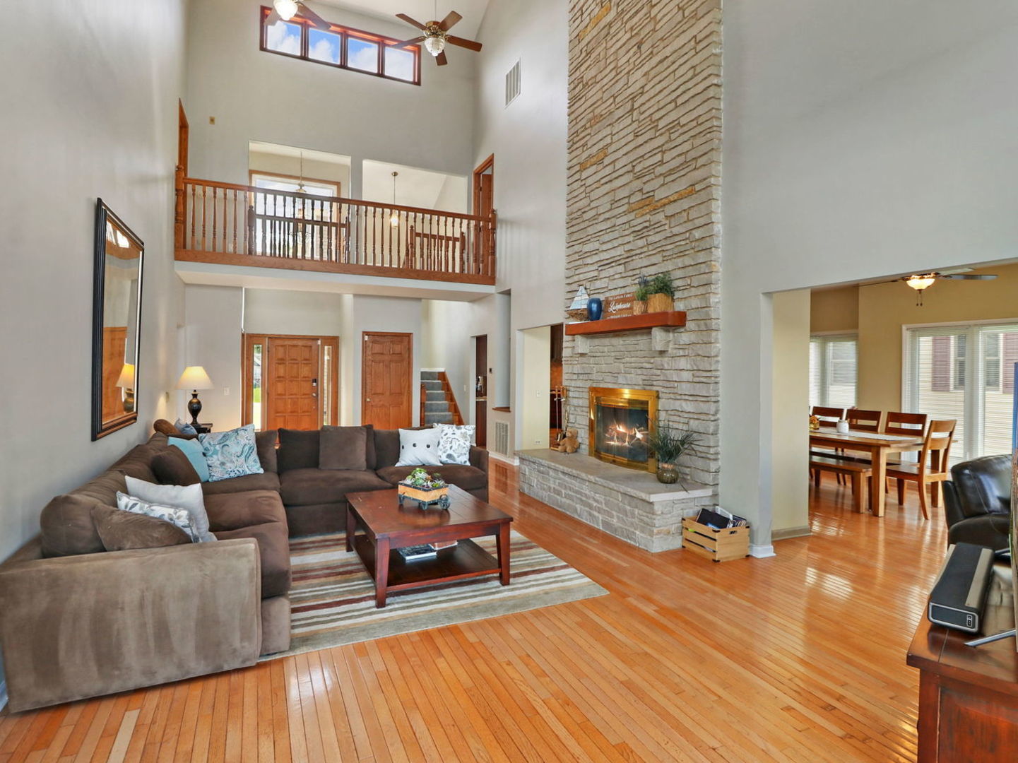132 Eagle Point Road Fox Lake, IL 60020 - Photo 8 of 63 a living room with furniture and a fireplace