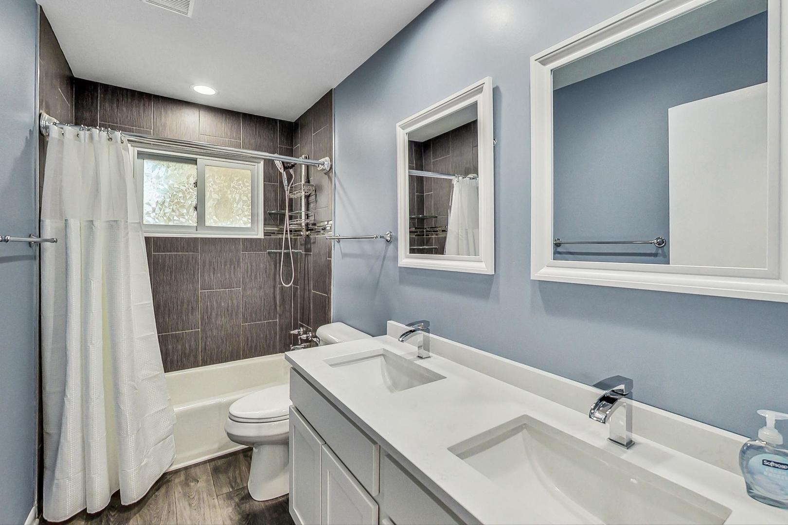 830 Russell Avenue Winthrop Harbor, IL 60096 - Photo 14 of 33 a bathroom with a sink toilet and shower