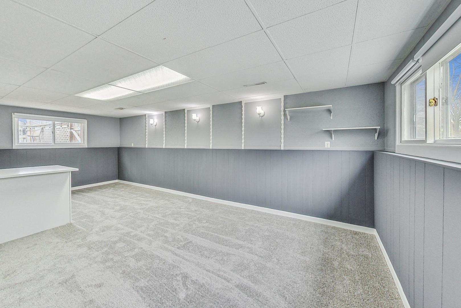 830 Russell Avenue Winthrop Harbor, IL 60096 - Photo 19 of 33 a view of an empty room with a kitchen