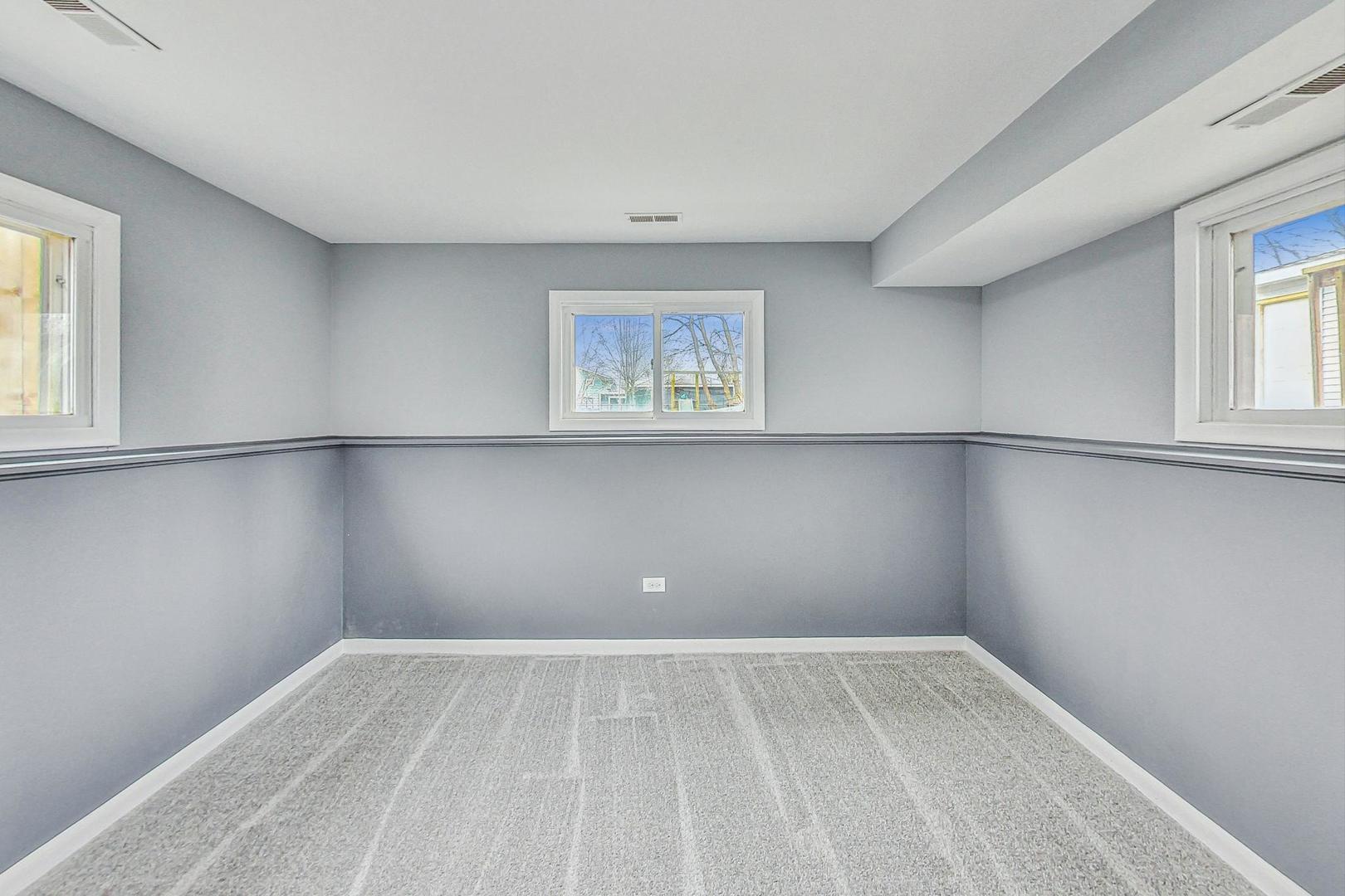 830 Russell Avenue Winthrop Harbor, IL 60096 - Photo 26 of 33 a view of an empty room with a window