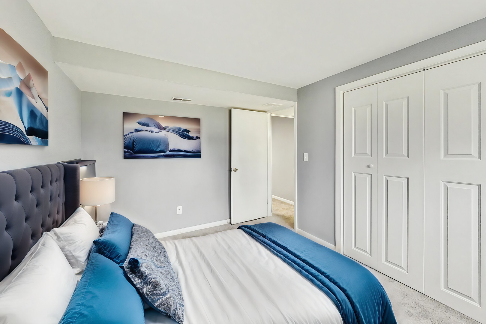 830 Russell Avenue Winthrop Harbor, IL 60096 - Photo 28 of 33 a bedroom with a large bed a couch and painting on the wall