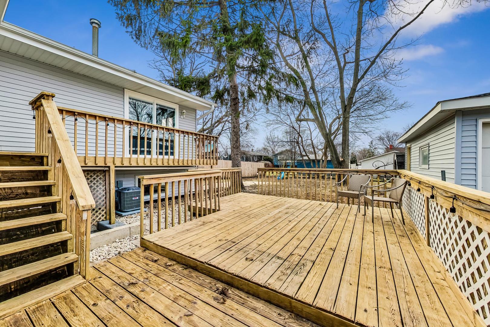 830 Russell Avenue Winthrop Harbor, IL 60096 - Photo 31 of 33 a balcony with wooden floor and city view