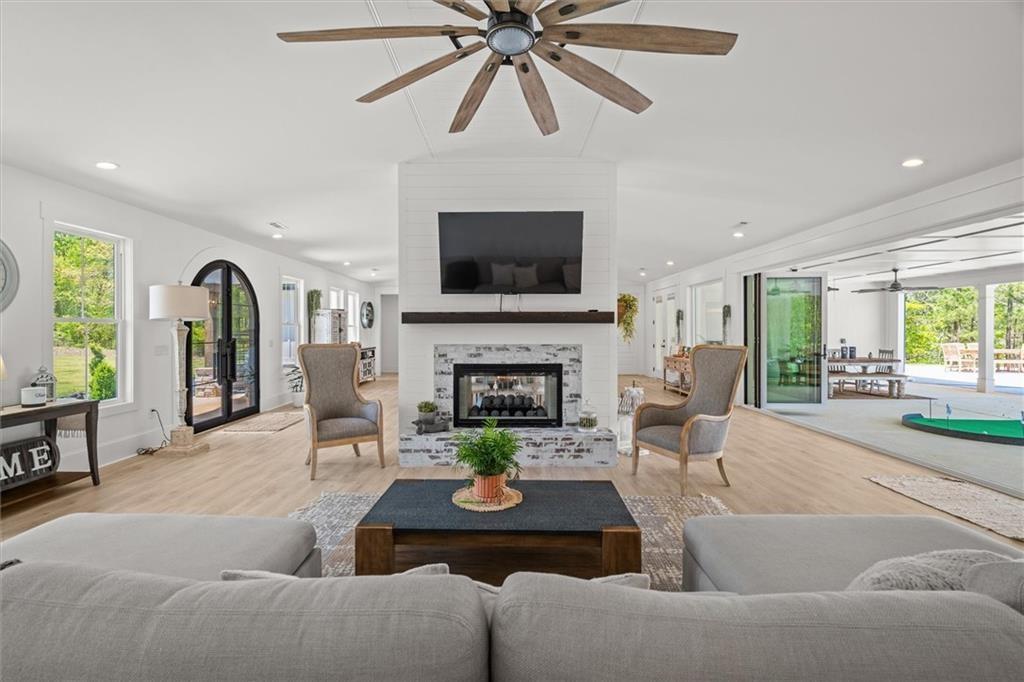 840 Old Driver Road Whitesburg, GA 30185 - Photo 15 of 88 a living room with furniture and a fireplace