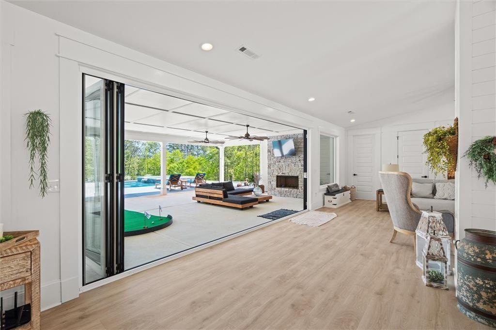 840 Old Driver Road Whitesburg, GA 30185 - Photo 21 of 88 a view of a livingroom with furniture and a garden