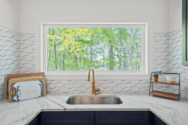 a kitchen with a sink and cabinets