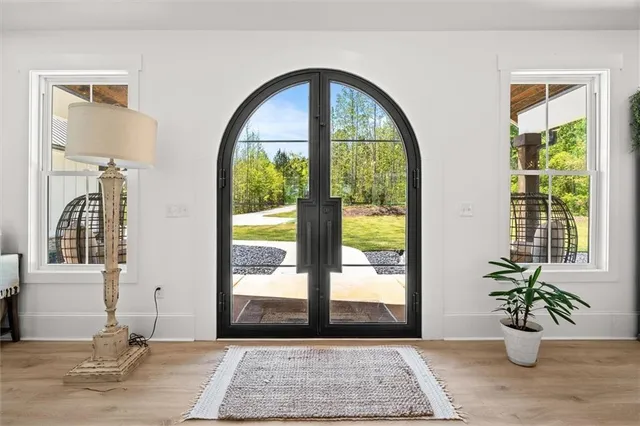 a view of a dining room with furniture window and wooden floor