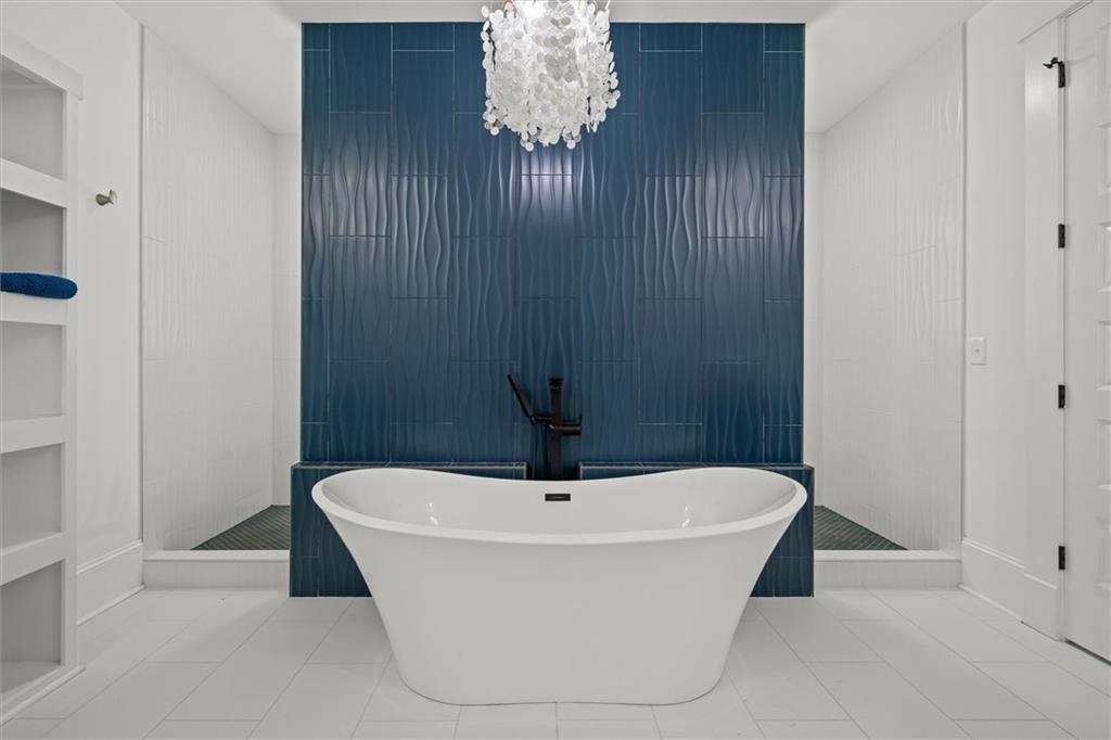 840 Old Driver Road Whitesburg, GA 30185 - Photo 32 of 88 a white bath tub sitting in a bathroom