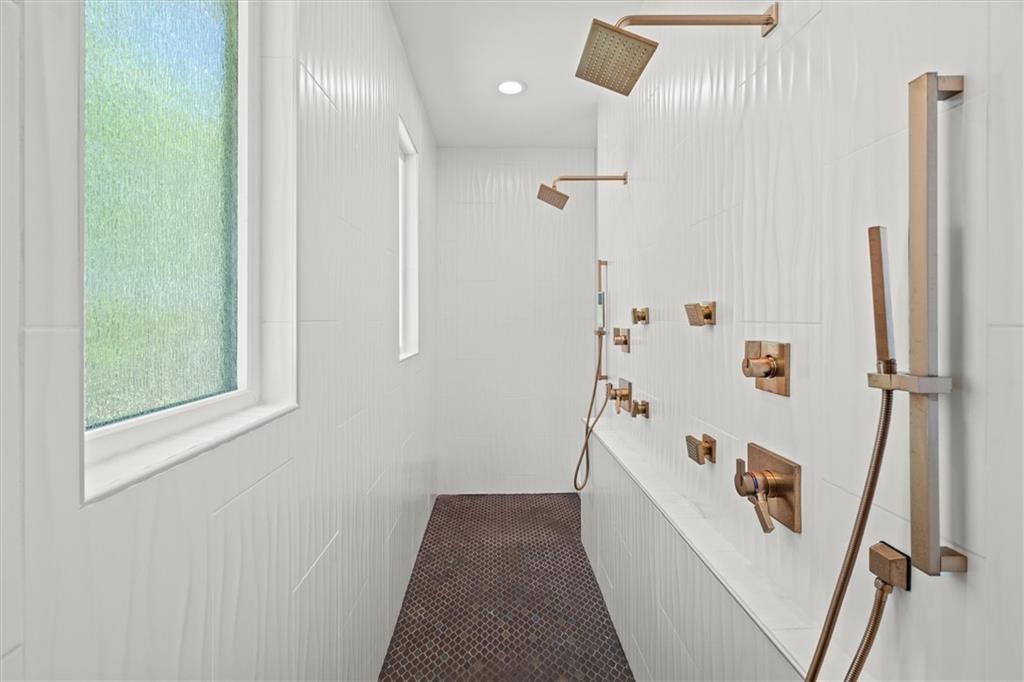 840 Old Driver Road Whitesburg, GA 30185 - Photo 34 of 88 a bathroom with a bathtub and a shower