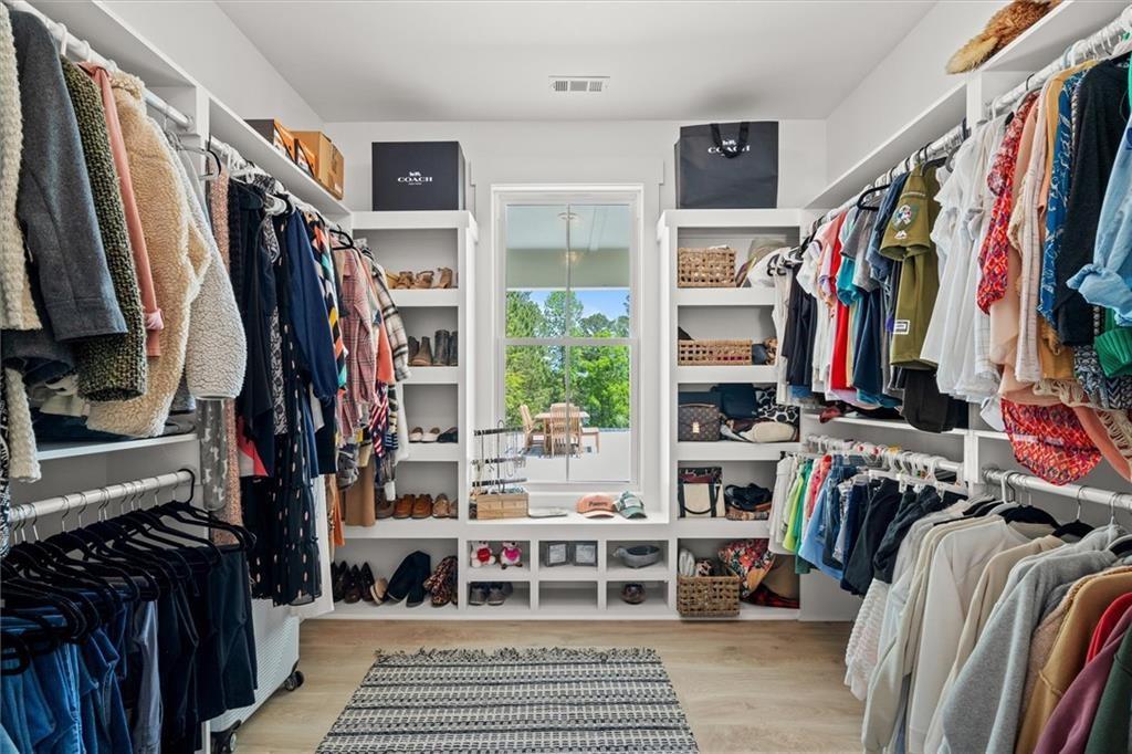 840 Old Driver Road Whitesburg, GA 30185 - Photo 35 of 88 a view of walk in closet with clothes and shoes