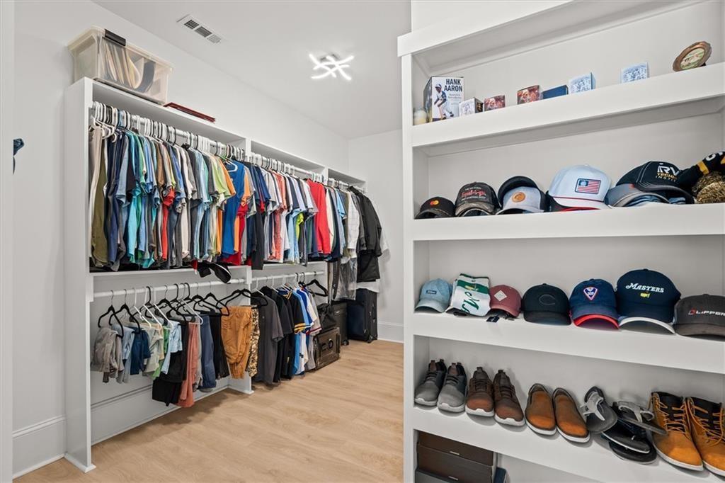 840 Old Driver Road Whitesburg, GA 30185 - Photo 36 of 88 a view of walk in closet with clothes and shoes