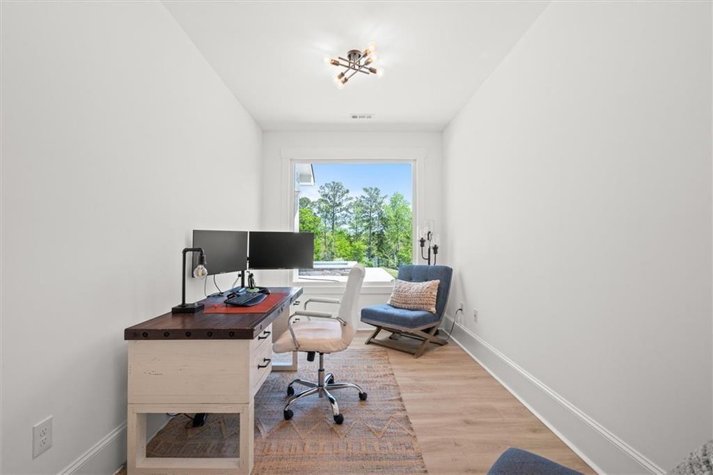 840 Old Driver Road Whitesburg, GA 30185 - Photo 39 of 88 a workspace with furniture and a potted plant