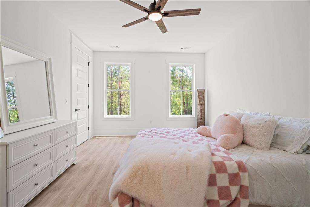 840 Old Driver Road Whitesburg, GA 30185 - Photo 44 of 88 a bedroom with a bed and a window