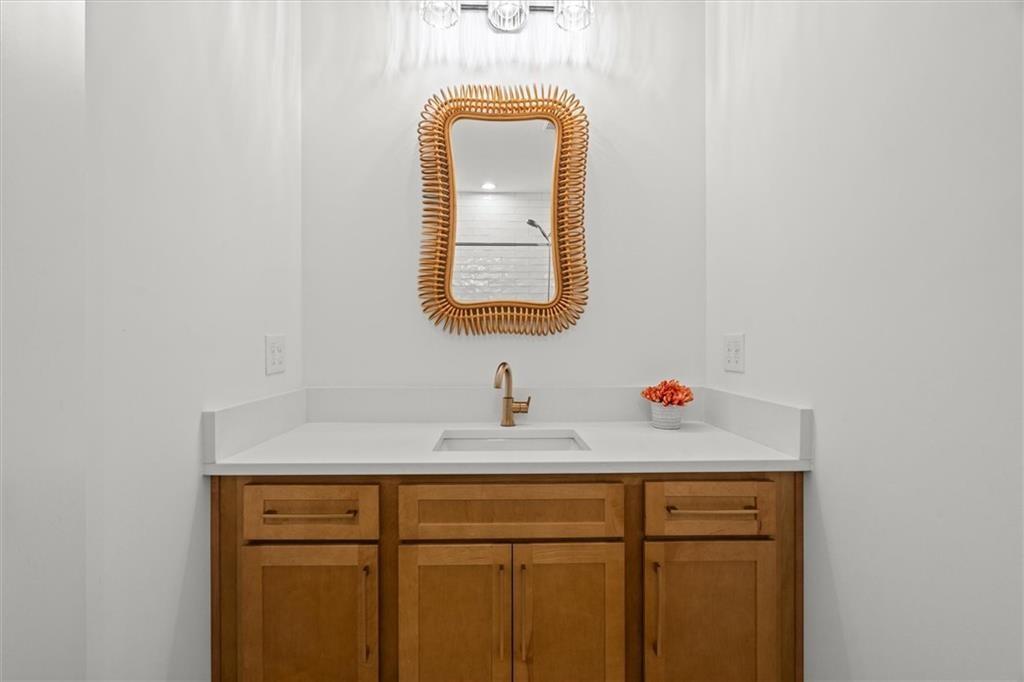 840 Old Driver Road Whitesburg, GA 30185 - Photo 45 of 88 a bathroom with a sink and a mirror