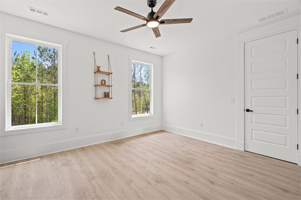 840 Old Driver Road Whitesburg, GA 30185 - Photo 50 of 88 wooden floor in an empty room with a window