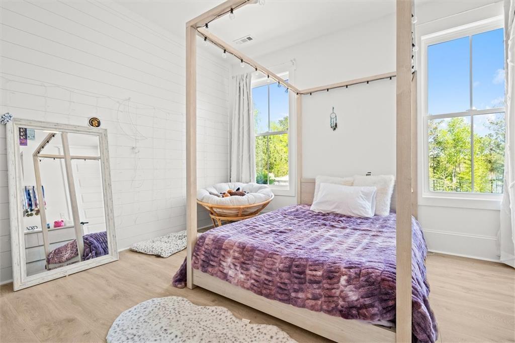 840 Old Driver Road Whitesburg, GA 30185 - Photo 52 of 88 a bedroom with a bed dresser and a window