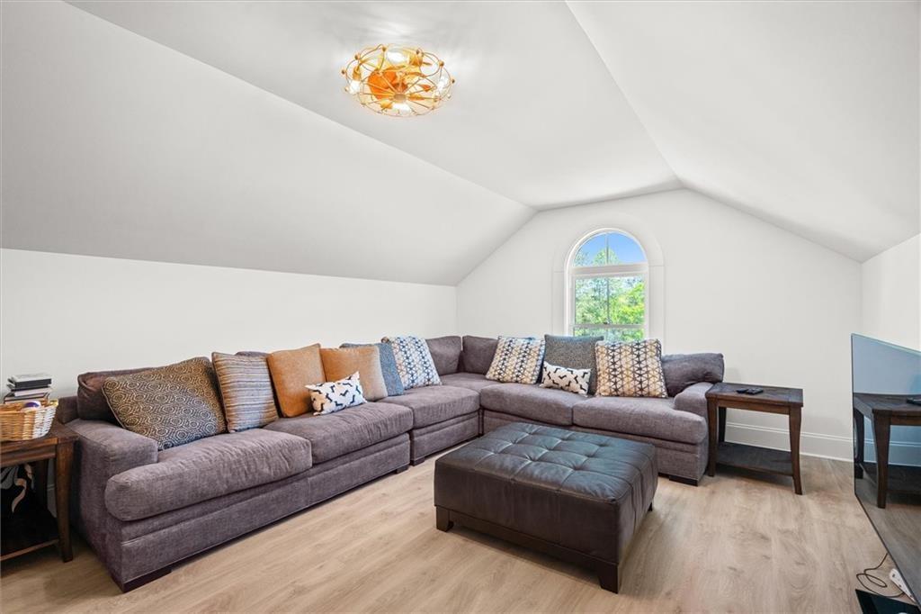 840 Old Driver Road Whitesburg, GA 30185 - Photo 58 of 88 a living room with furniture and a wooden floor