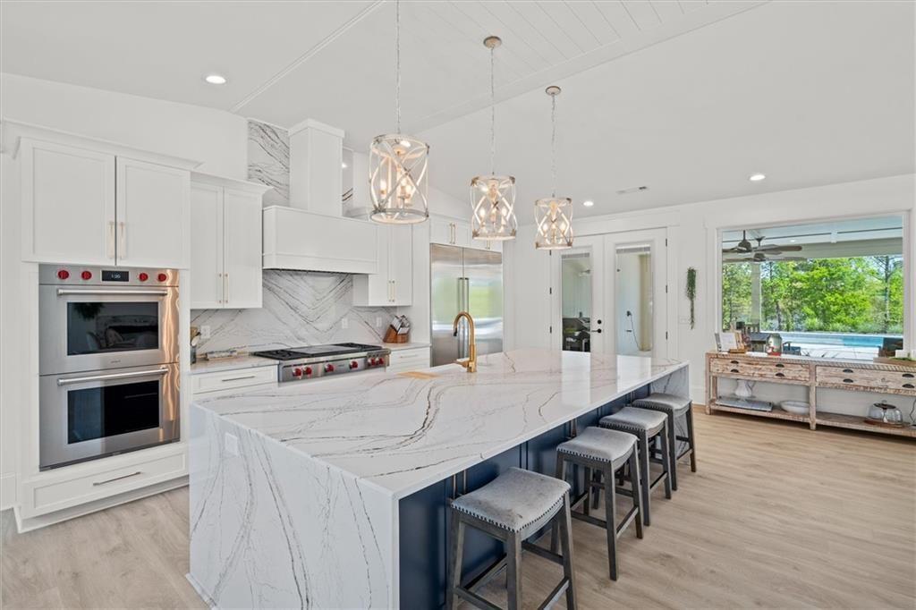 840 Old Driver Road Whitesburg, GA 30185 - Photo 6 of 88 a large kitchen with kitchen island a large island in the center