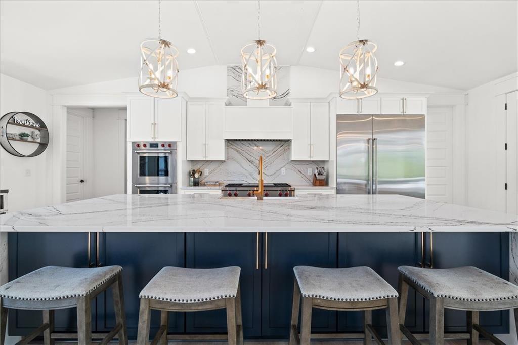 840 Old Driver Road Whitesburg, GA 30185 - Photo 7 of 88 a view of a dining room with furniture a chandelier and wooden floor