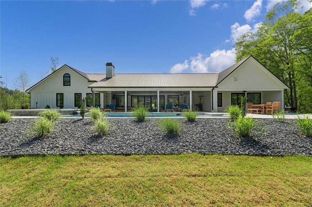 840 Old Driver Road Whitesburg, GA 30185 - Photo 75 of 88 a front view of a house with a garden