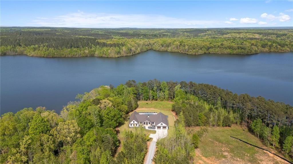 840 Old Driver Road Whitesburg, GA 30185 - Photo 81 of 88 a view of a lake with a building in the background