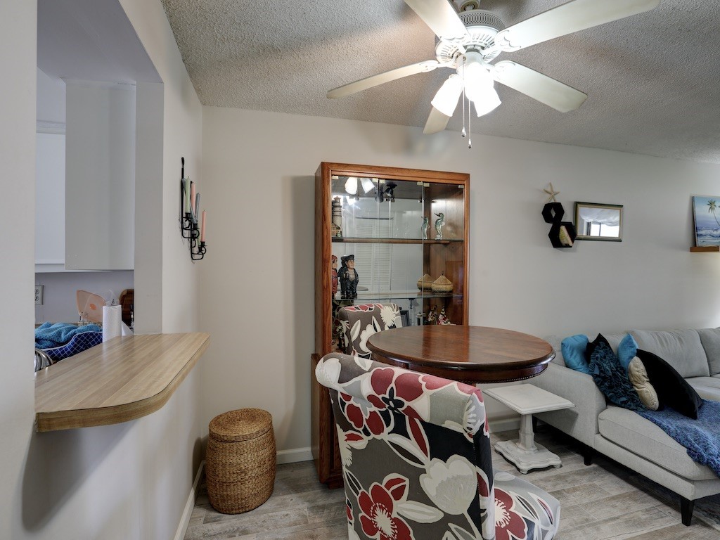 6022 Indrio Road, Unit G3 Fort Pierce, FL 34951 - Photo 16 of 36 a dining room with furniture and a chandelier