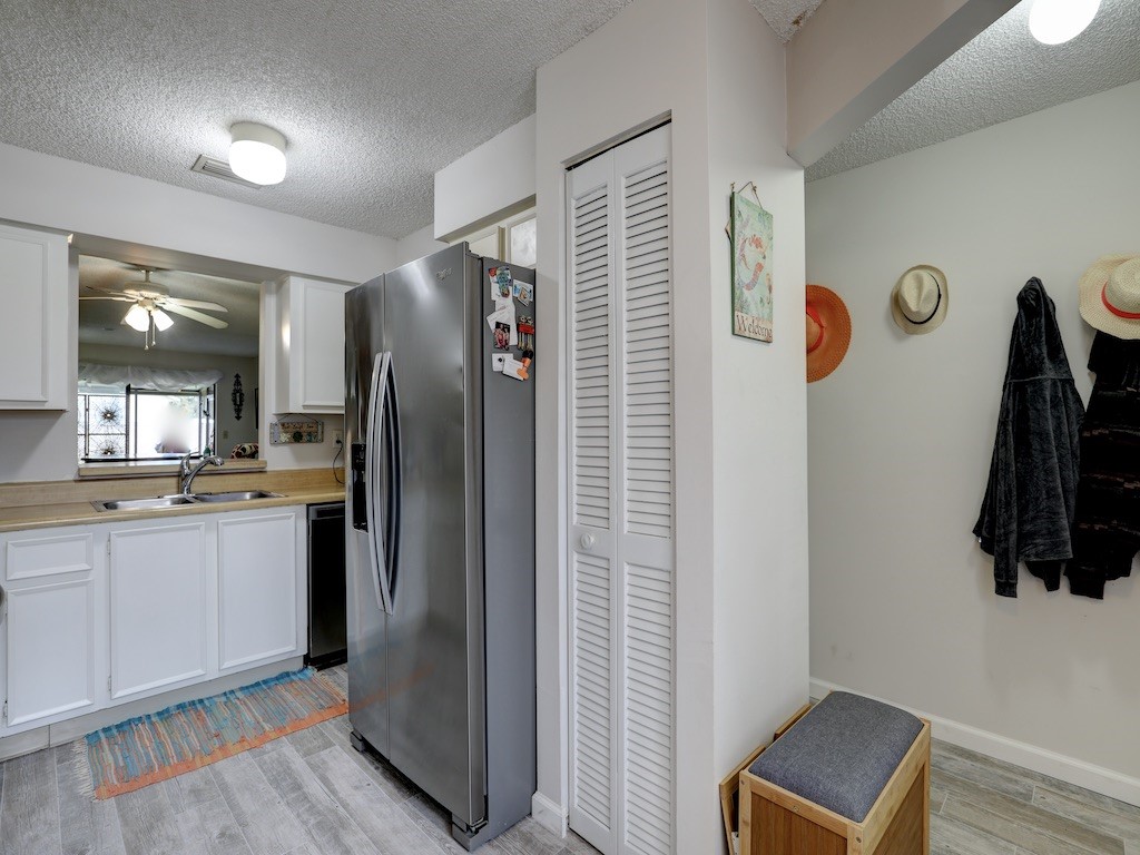 6022 Indrio Road, Unit G3 Fort Pierce, FL 34951 - Photo 22 of 36 a kitchen with stainless steel appliances granite countertop a refrigerator and a sink