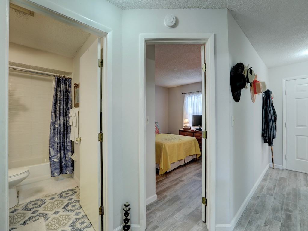 6022 Indrio Road, Unit G3 Fort Pierce, FL 34951 - Photo 29 of 36 a bedroom with a bed and a mirror