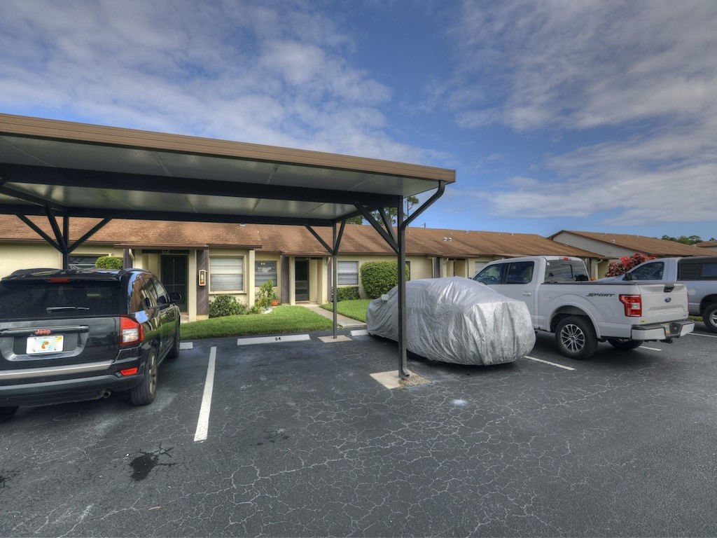 6022 Indrio Road, Unit G3 Fort Pierce, FL 34951 - Photo 4 of 36 a view of parking area