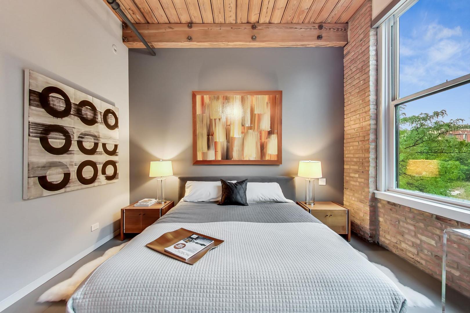 1327 West Washington Boulevard, Unit 2H Chicago, IL 60607 - Photo 13 of 31 a bedroom with a bed and a window