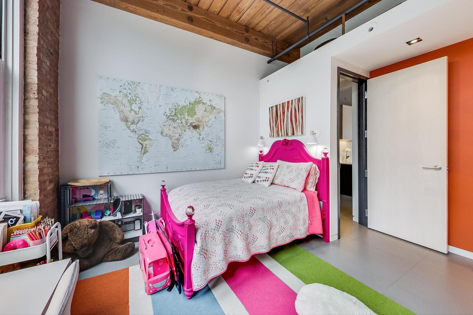 1327 West Washington Boulevard, Unit 2H Chicago, IL 60607 - Photo 19 of 31 a bedroom with a bed and a painting on the wall