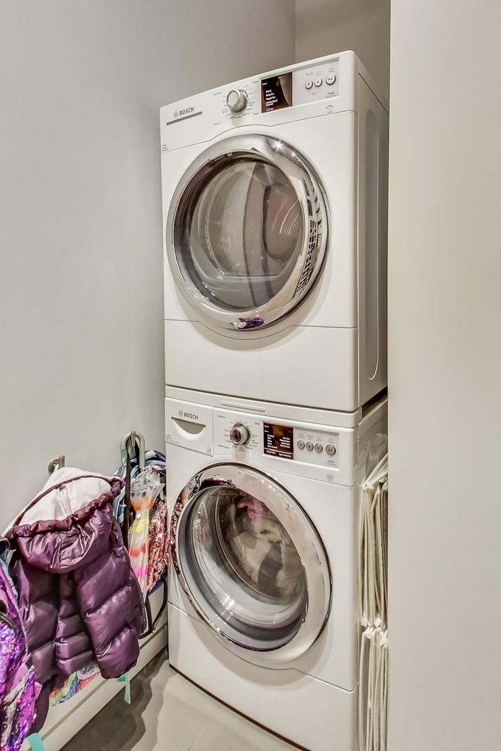 1327 West Washington Boulevard, Unit 2H Chicago, IL 60607 - Photo 22 of 31 a utility room with dryer and washer