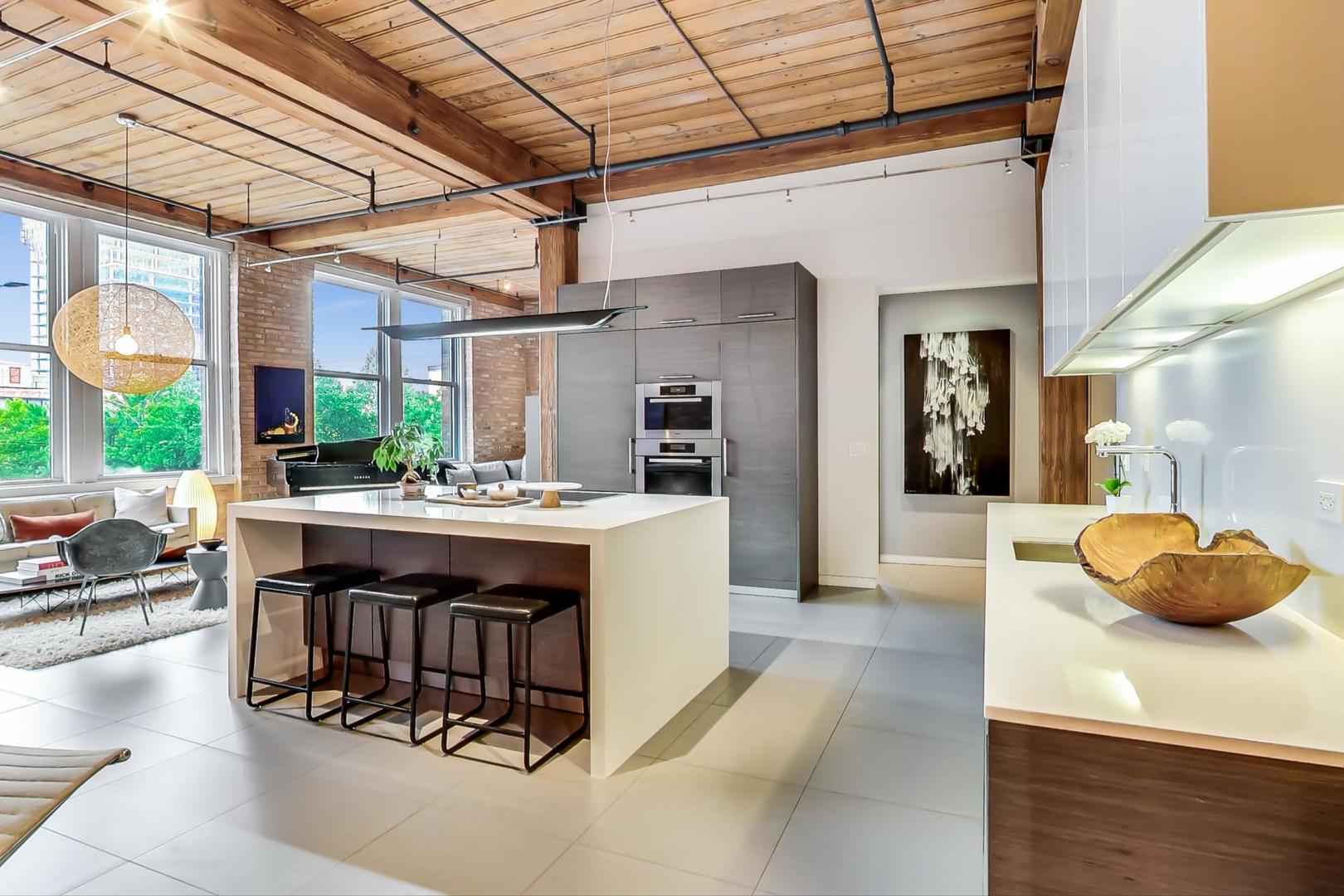 1327 West Washington Boulevard, Unit 2H Chicago, IL 60607 - Photo 8 of 31 a living room with granite countertop furniture and a large window