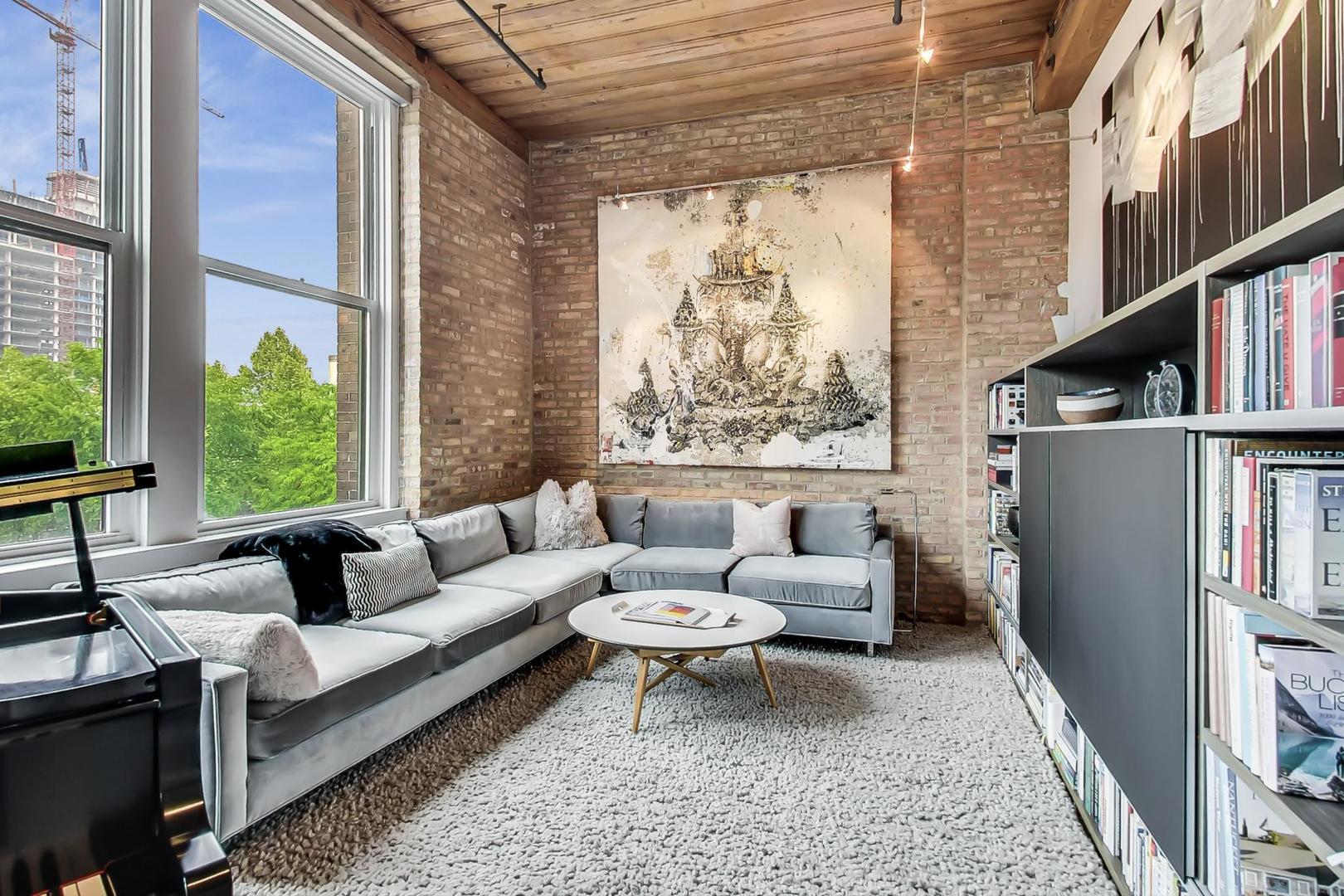 1327 West Washington Boulevard, Unit 2H Chicago, IL 60607 - Photo 9 of 31 a living room with furniture and a rug