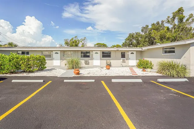a view of a house with a swimming pool and a porch