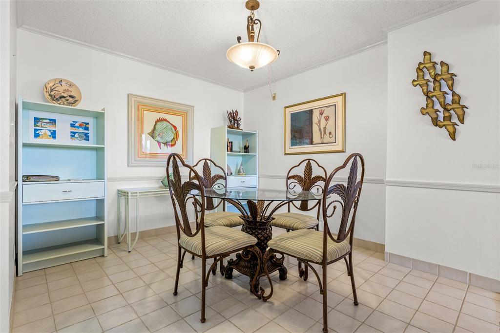 1 Key Capri, Unit 104E Treasure Island, FL 33706 - Photo 12 of 45 a view of a dining room with furniture