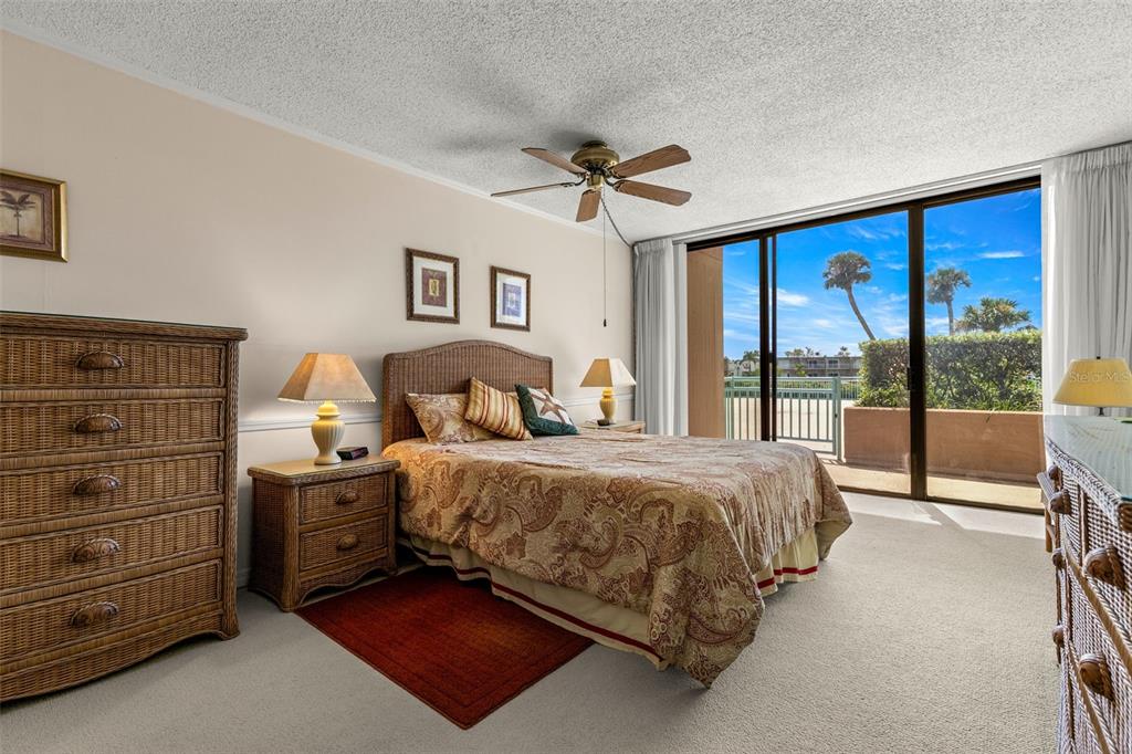 1 Key Capri, Unit 104E Treasure Island, FL 33706 - Photo 17 of 45 a spacious bedroom with a bed and a dresser