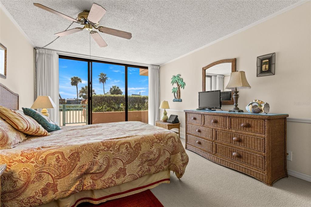 1 Key Capri, Unit 104E Treasure Island, FL 33706 - Photo 18 of 45 a bedroom with a bed and a window