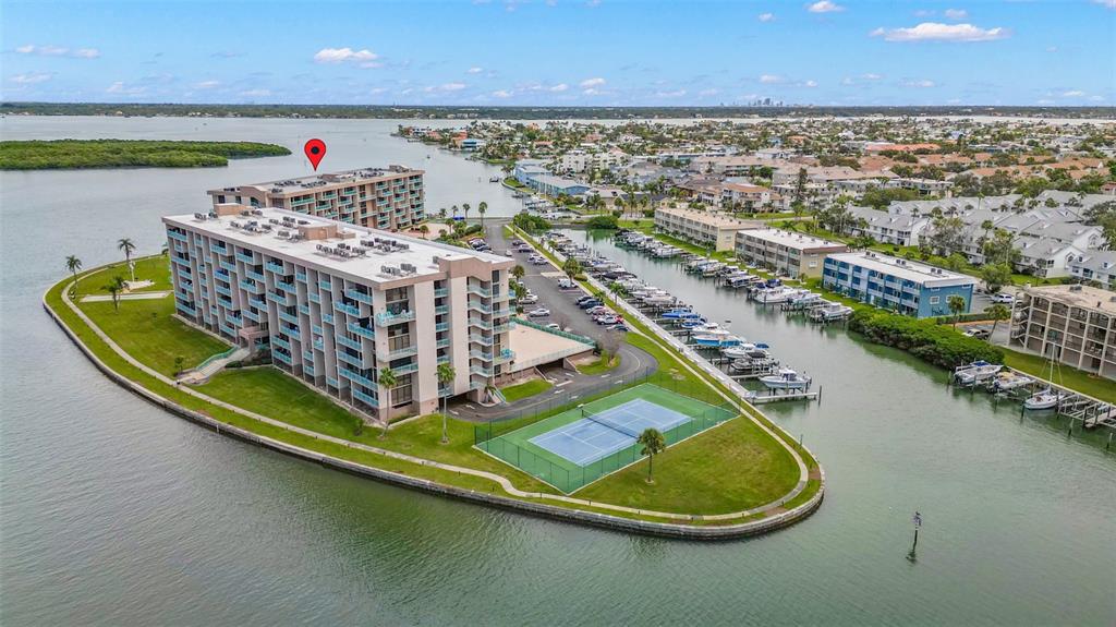 1 Key Capri, Unit 104E Treasure Island, FL 33706 - Photo 41 of 45 a view of a swimming pool with a lake view
