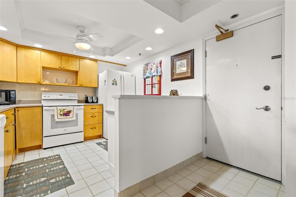 1 Key Capri, Unit 104E Treasure Island, FL 33706 - Photo 5 of 45 a view of utility room with washer and dryer