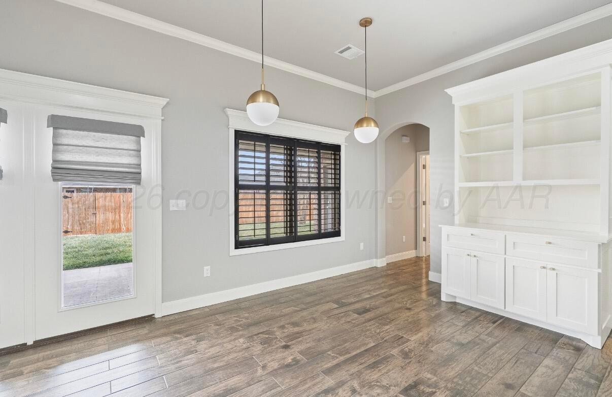 36 Quay Lane Canyon, TX 79015 - Photo 11 of 28 a view of an empty room with a window and wooden floor