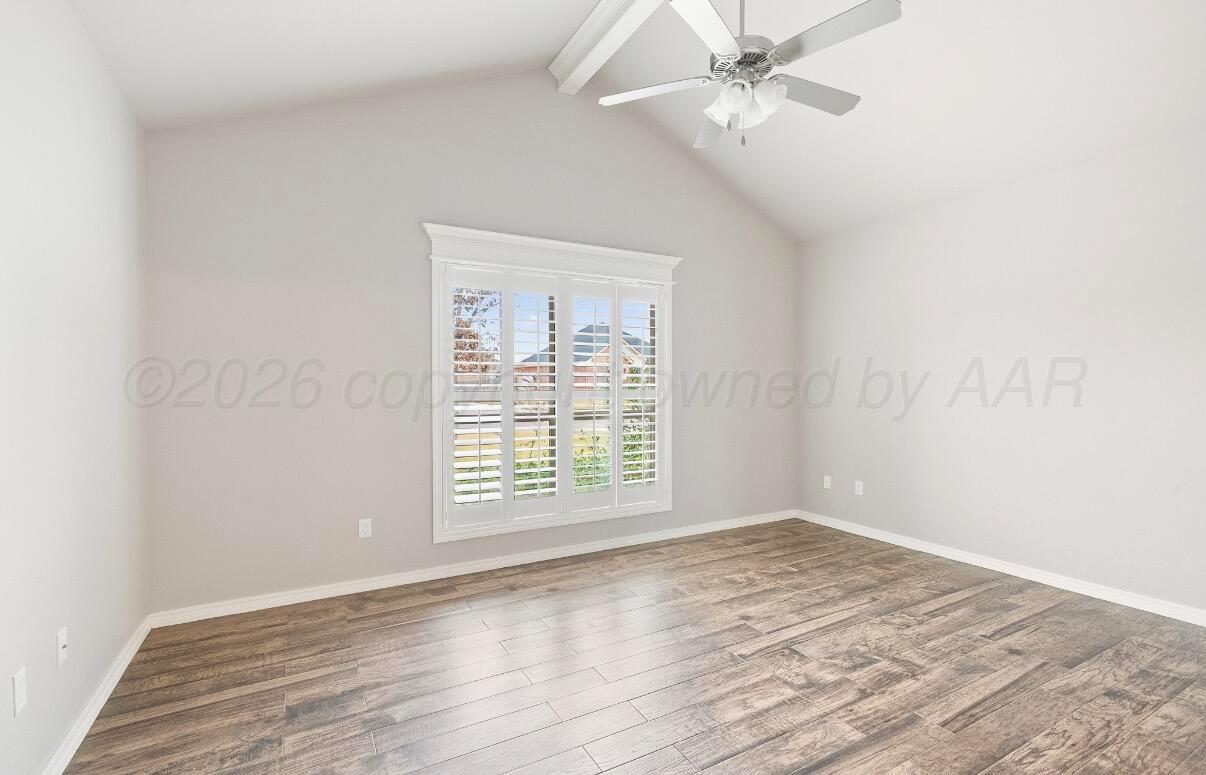 36 Quay Lane Canyon, TX 79015 - Photo 12 of 28 an empty room with wooden floor fan and windows