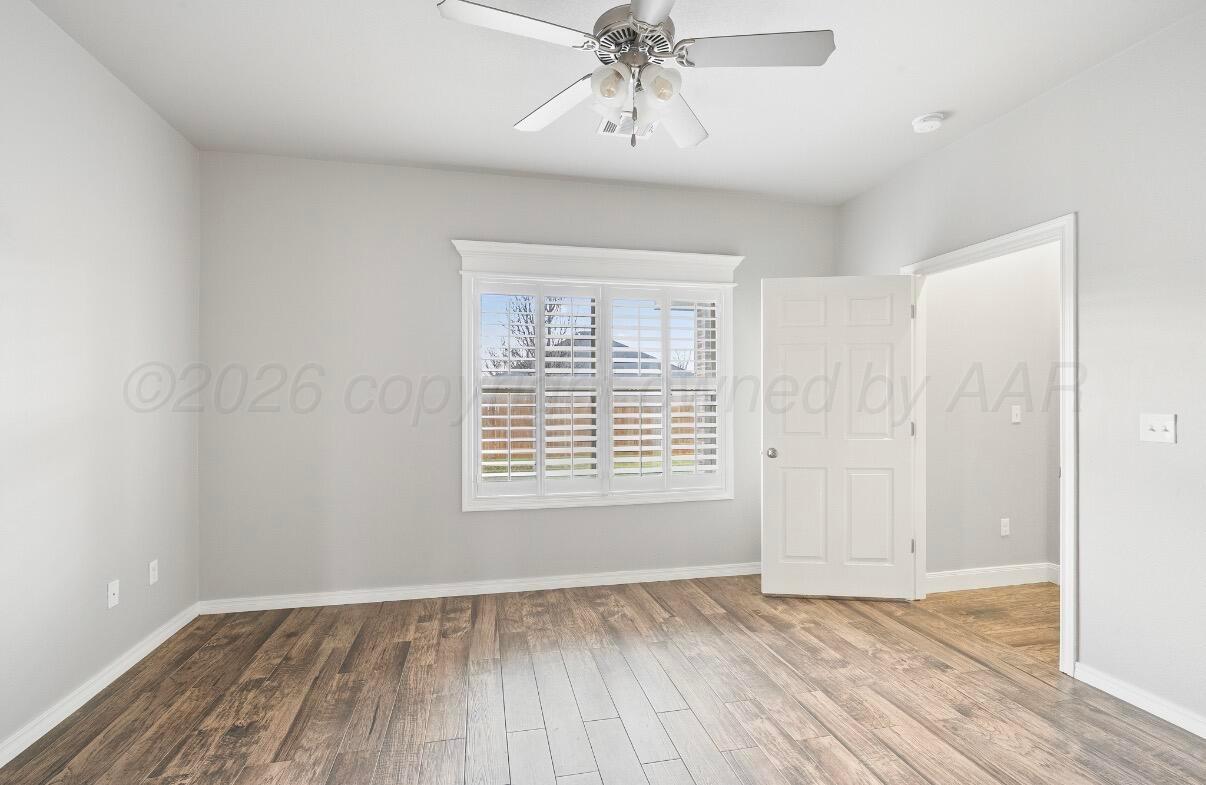 36 Quay Lane Canyon, TX 79015 - Photo 20 of 28 wooden floor in an empty room with a window