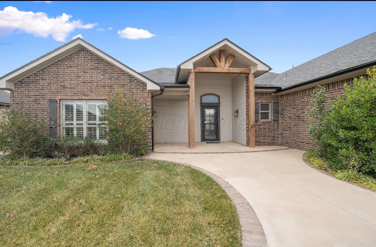 36 Quay Lane Canyon, TX 79015 - Photo 2 of 28 a front view of a house with a garden
