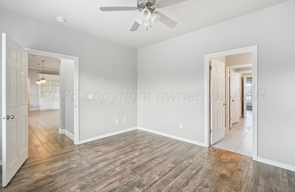36 Quay Lane Canyon, TX 79015 - Photo 21 of 28 wooden floor in an empty room with a bathroom