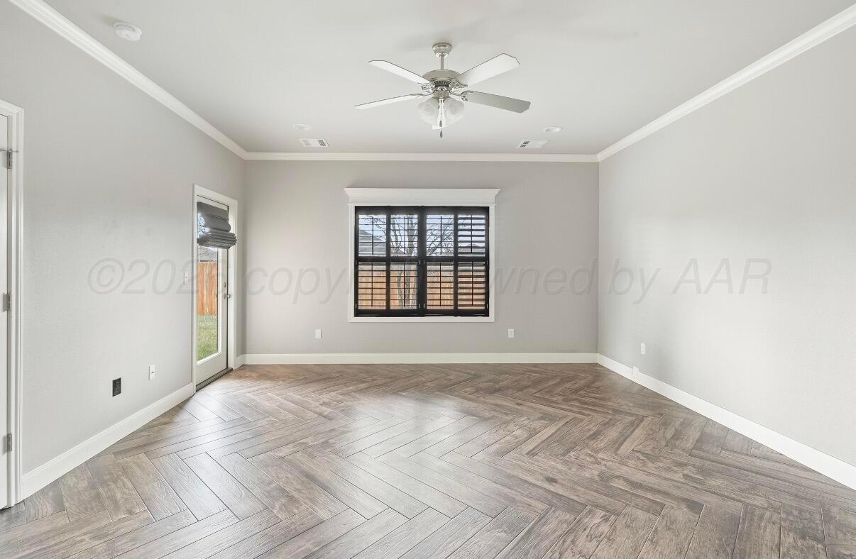 36 Quay Lane Canyon, TX 79015 - Photo 22 of 28 a view of an empty room with a window and a ceiling fan