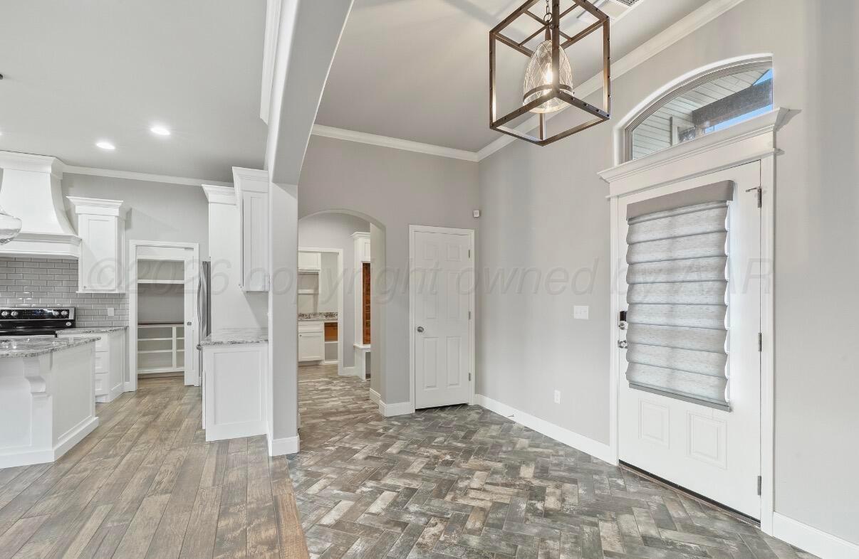 36 Quay Lane Canyon, TX 79015 - Photo 4 of 28 a view of a hallway with wooden floor and staircase