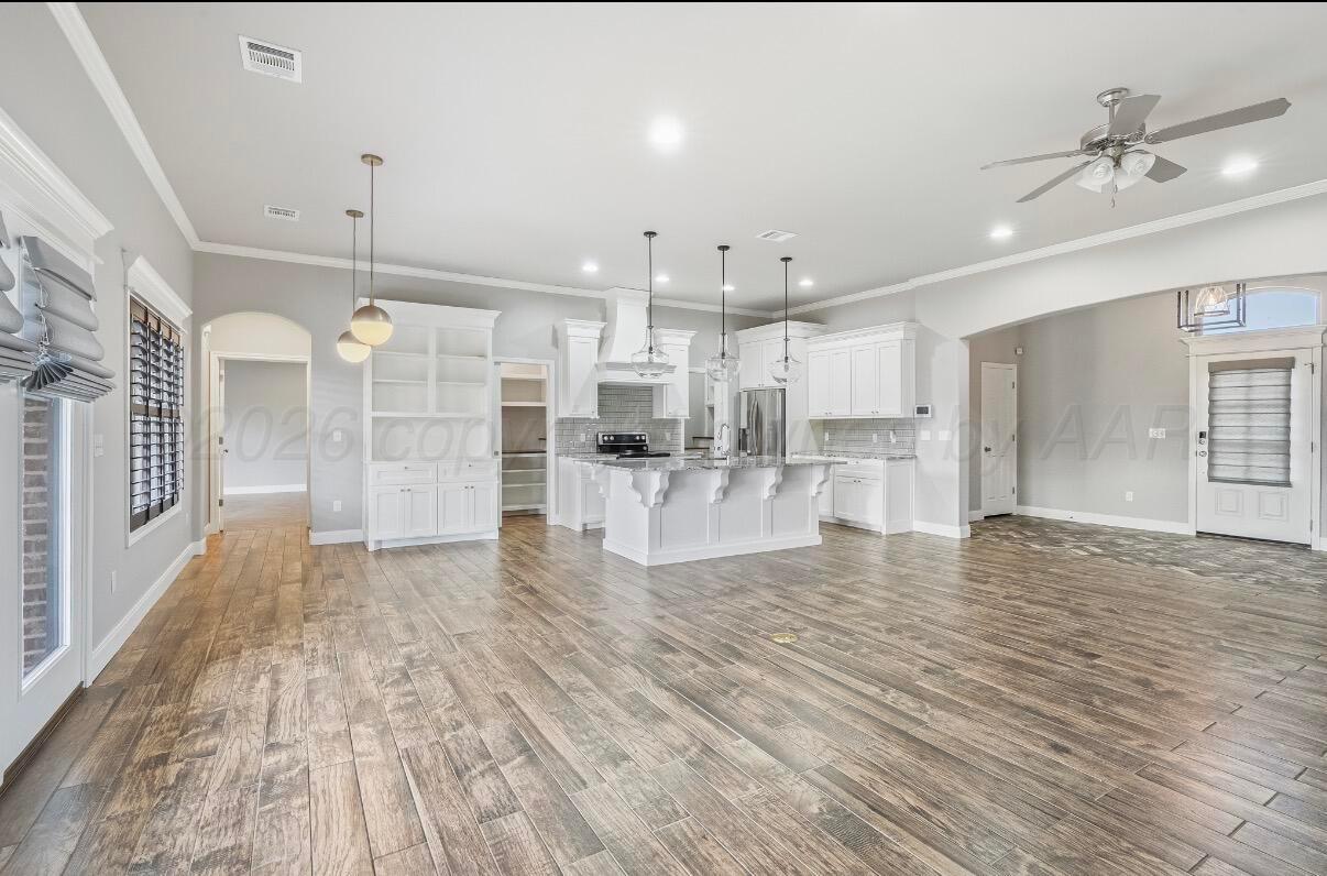 36 Quay Lane Canyon, TX 79015 - Photo 7 of 28 a view of empty room with wooden floor and fan